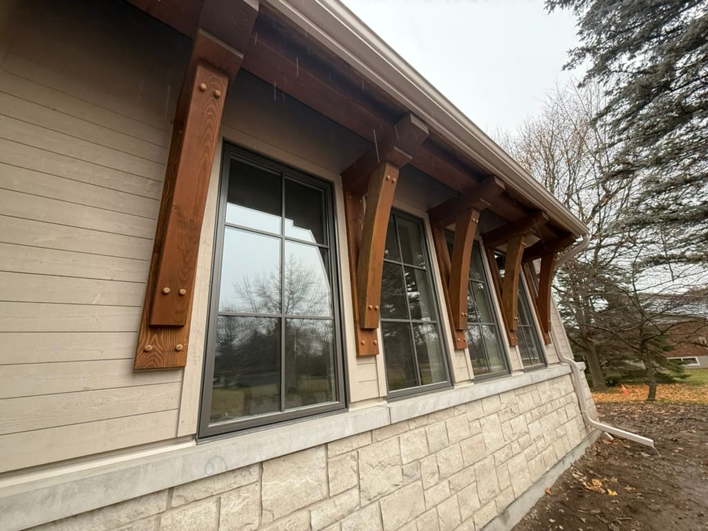 Exterior timber brackets, windows and masonry detail