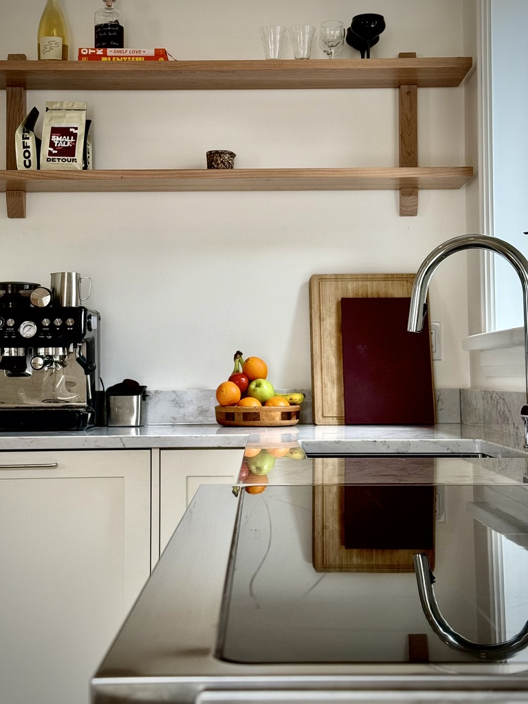 Open wood shelving and sink area