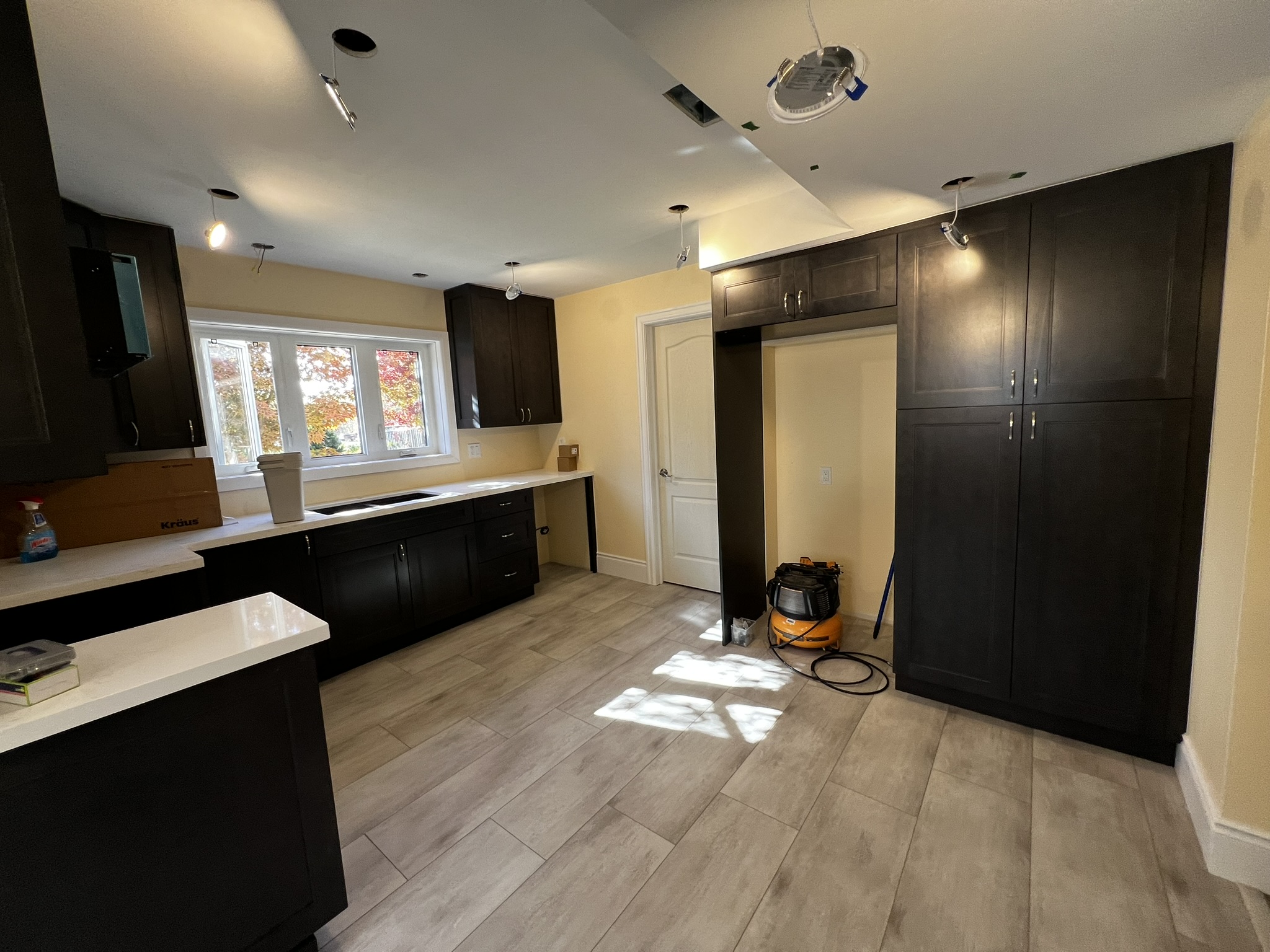 Finished dark-cabinet kitchen from a Guelph-area renovation
