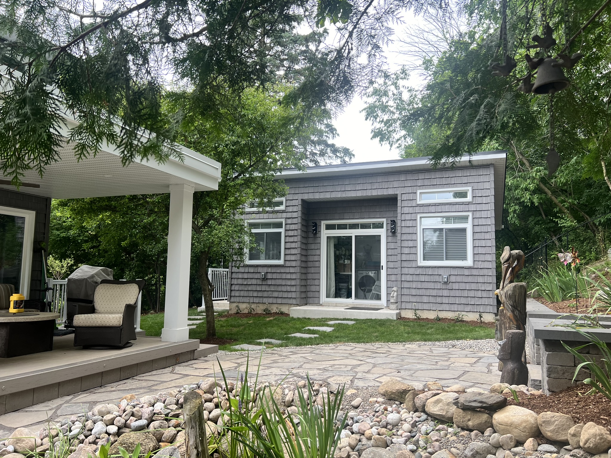 Studio connected to the existing patio and landscape