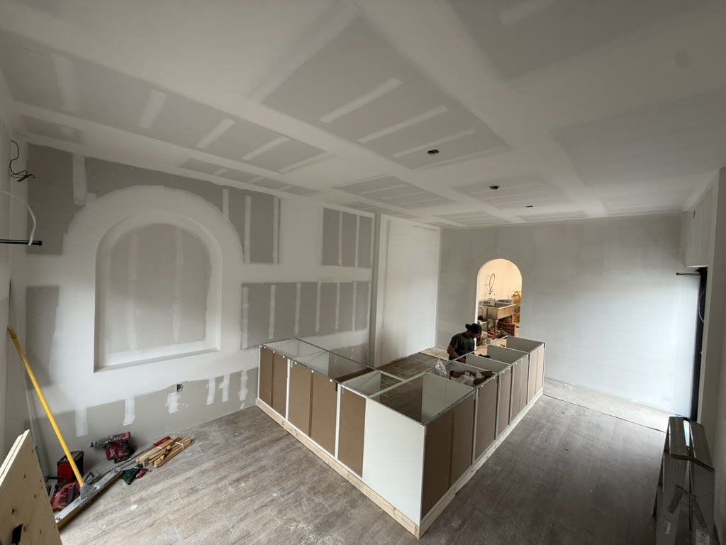 Arched openings and counter construction during the fit-out