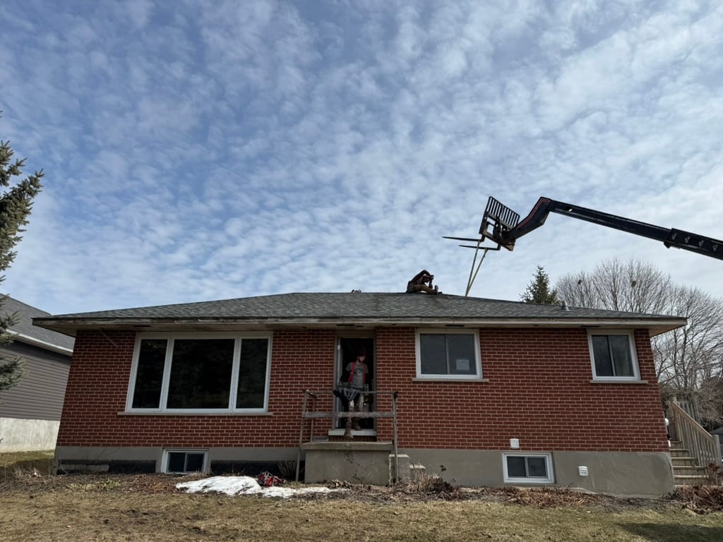 Existing roof removal during the MacDonald project