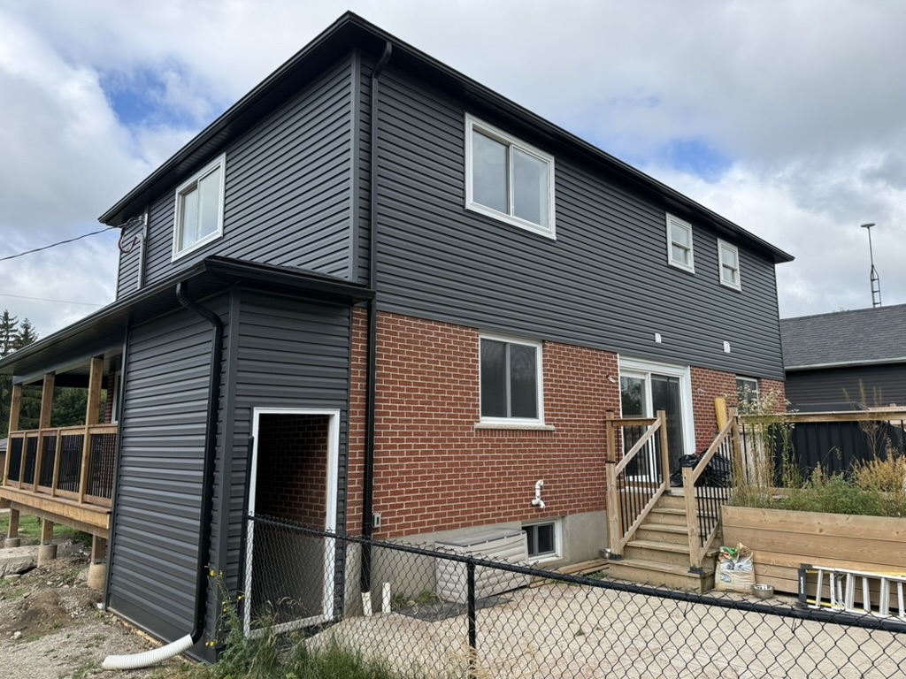 Side view of the MacDonald addition and completed exterior cladding
